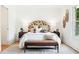 Cozy main bedroom with a unique headboard, bench, and accent rug at 43 Heathwood Dr, Charleston, SC 29407