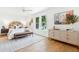 Bright main bedroom with large windows, wood floors, and stylish decor at 43 Heathwood Dr, Charleston, SC 29407