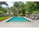 Backyard in-ground pool with poolside lounge chairs and surrounding landscaping at 43 Heathwood Dr, Charleston, SC 29407