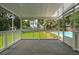 Relaxing screened porch with a view of the pool and backyard at 43 Heathwood Dr, Charleston, SC 29407