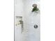 Elegant shower with stylish marble-look tiles, niche, rainfall showerhead, and modern fixtures at 43 Heathwood Dr, Charleston, SC 29407