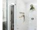 Beautiful shower featuring white marble tiling, built in niche, and glass door at 43 Heathwood Dr, Charleston, SC 29407