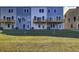 Exterior back of home showcasing a back deck and well-maintained lawn at 430 Caledon Court Ct, Johns Island, SC 29455