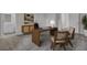 Bright home office with modern desk and chairs, complemented by stylish decor and ample storage at 469 Caledon Ct, Johns Island, SC 29455