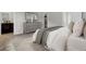 Spacious bedroom showcasing a comfortable bed, dresser, and open doorway, creating an inviting and airy atmosphere at 475 Caledon Ct, Johns Island, SC 29455
