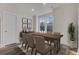 Elegant dining room with a wooden table, comfortable seating, and stylish decor, perfect for Gathering gatherings at 475 Caledon Ct, Johns Island, SC 29455