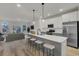 Open-concept kitchen featuring a spacious island, modern appliances, and seamless flow to the living area at 475 Caledon Ct, Johns Island, SC 29455