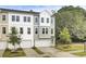 Newly constructed townhome showcasing tidy landscaping, gray siding, and a one-car garage at 501 Caledon Ct, Johns Island, SC 29455
