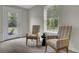 Bright sitting room with two chairs near a window and door at 501 Caledon Ct, Johns Island, SC 29455