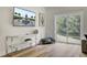Bright living area featuring stylish decor, hardwood floors, and a sliding glass door with a view of the outdoors at 501 Caledon Ct, Johns Island, SC 29455