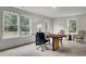 Bright office features a modern desk, large windows, and stylish chairs at 501 Caledon Ct, Johns Island, SC 29455