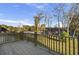 View from a wooden back deck with railings overlooks a green landscape and neighborhood street at 503 Caledon Court Ct, Johns Island, SC 29455