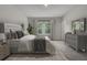Bedroom with a large bed, neutral decor, and a window with natural light at 503 Caledon Court Ct, Johns Island, SC 29455