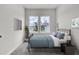 Comfortable bedroom featuring two bright windows and neutral decor at 503 Caledon Court Ct, Johns Island, SC 29455