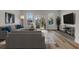 Spacious living room with a comfortable gray sectional sofa and lots of natural light at 503 Caledon Court Ct, Johns Island, SC 29455