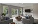 Bright living room with plush seating, a round coffee table, and a sliding glass door at 503 Caledon Court Ct, Johns Island, SC 29455