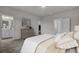 Calm main bedroom showcases modern decor and access to the en-suite bathroom with soft lighting at 503 Caledon Court Ct, Johns Island, SC 29455