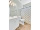 Bathroom with shower, toilet, vanity, large mirror and modern shower curtain at 5406 Dwight Dr, North Charleston, SC 29420