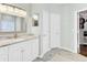 Bathroom with a vanity, sink, and an open closet with shelving for storage at 5406 Dwight Dr, North Charleston, SC 29420