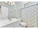 Bathroom with shower, toilet, vanity, large mirror and modern shower curtain at 5406 Dwight Dr, North Charleston, SC 29420