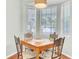 Cozy dining nook featuring abundant natural light from windows with views of the surrounding landscape at 5406 Dwight Dr, North Charleston, SC 29420