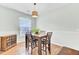 Charming dining area with a wooden table and chairs set, perfect for Gathering meals at 5406 Dwight Dr, North Charleston, SC 29420