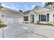 Beautiful single-story home showcasing a large driveway, attached garage, and covered entryway at 5406 Dwight Dr, North Charleston, SC 29420