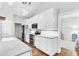 Modern kitchen featuring white cabinetry, stainless steel appliances, and hardwood flooring at 5406 Dwight Dr, North Charleston, SC 29420