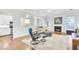 Open-concept living room boasts hardwood floors, fireplace, and an archway leading to the kitchen at 5406 Dwight Dr, North Charleston, SC 29420