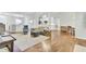 Spacious, open-concept living area with hardwood floors and stylish seating next to kitchen and dining at 5406 Dwight Dr, North Charleston, SC 29420