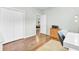 Office space with closet, wooden floors, desk, rolling chair, and printer setup at 5406 Dwight Dr, North Charleston, SC 29420