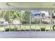 Screened-in porch with beautiful view of the backyard, shed and surrounding foliage at 5406 Dwight Dr, North Charleston, SC 29420