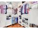 Organized walk-in closet with shelving and hanging storage for clothes, shoes and personal items at 5406 Dwight Dr, North Charleston, SC 29420