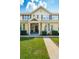 Charming front porch with American flag, seating, and welcoming entrance at 5511 Colonial Chatsworth Cir, North Charleston, SC 29418
