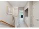 Upstairs hallway leads to laundry room and bedrooms at 5511 Colonial Chatsworth Cir, North Charleston, SC 29418