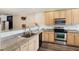 Updated kitchen featuring granite countertops, stainless steel appliances, and wood cabinets at 5511 Colonial Chatsworth Cir, North Charleston, SC 29418
