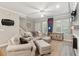 Inviting living room boasts neutral tones and a charming South Carolina accent wall at 5511 Colonial Chatsworth Cir, North Charleston, SC 29418