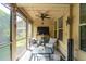 Inviting screened-in porch offering a cozy seating area and relaxing outdoor experience at 5511 Colonial Chatsworth Cir, North Charleston, SC 29418