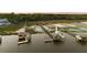 Drone view of covered dock featuring a boat lift and a tranquil waterfront setting at 627 Barbados Dr, Charleston, SC 29492