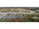 Aerial view of waterfront property with multiple docks extending into the waterway at 627 Barbados Dr, Charleston, SC 29492