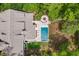 Birds eye view highlighting the outdoor space, pool, lounge chairs, and firepit area at 627 Barbados Dr, Charleston, SC 29492