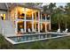 Inviting backyard with a pristine pool, covered porch and lounge chairs at 627 Barbados Dr, Charleston, SC 29492