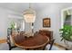 Elegant dining room features a wood table, decorative chandelier, and views into the Gathering room at 627 Barbados Dr, Charleston, SC 29492