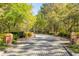 Charming cobblestone entrance with brick pillars, welcoming residents and guests to the community at 627 Barbados Dr, Charleston, SC 29492