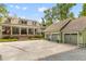 Spacious home with a three-car garage, brick-lined driveway, and well-manicured front yard at 627 Barbados Dr, Charleston, SC 29492