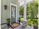 Welcoming front porch with potted plants and a decorative doormat at 627 Barbados Dr, Charleston, SC 29492