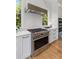 Modern kitchen features stainless steel appliances, including a gas range and white subway tile backsplash at 627 Barbados Dr, Charleston, SC 29492