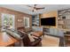 Cozy living room featuring a brick wall, custom built-ins, comfortable seating and lots of natural light at 627 Barbados Dr, Charleston, SC 29492