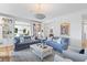 Bright living room with hardwood floors, recessed lighting and built in bookshelves at 627 Barbados Dr, Charleston, SC 29492