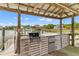 Outdoor kitchen with a built-in grill, countertop, and sink, perfect for waterfront entertaining at 627 Barbados Dr, Charleston, SC 29492